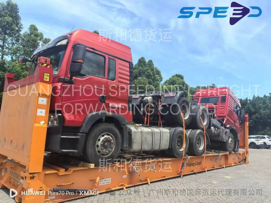 Flat rack shipping two heavy tractor trucks as OOG cargo